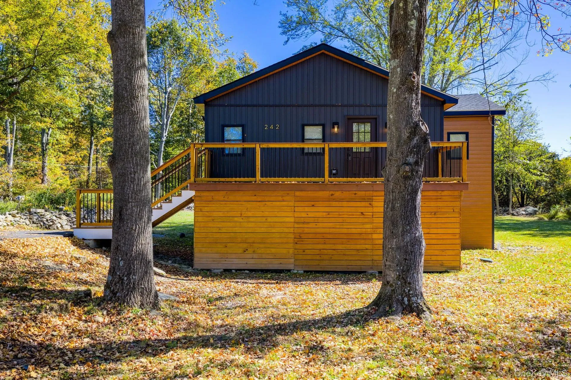 Log home surrounded by autumn colors in the Northwoods
