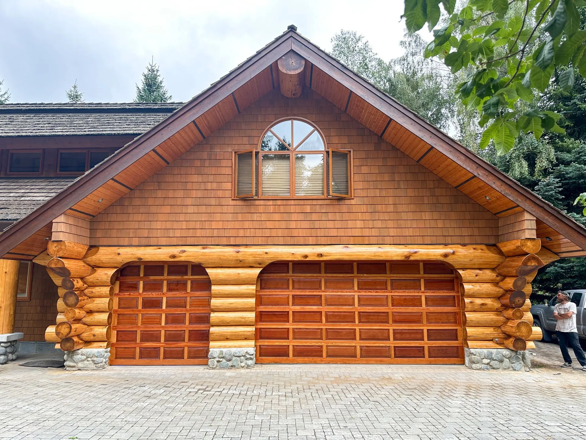 Beautifully restored log home with timber garage doors