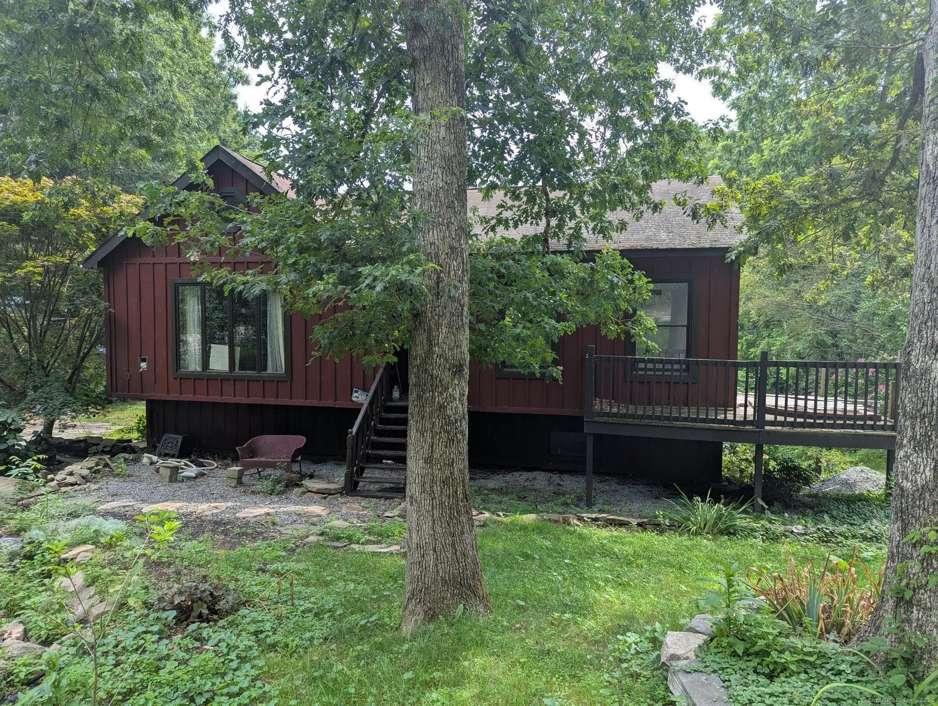 Stained log cabin nestled in the Northwoods